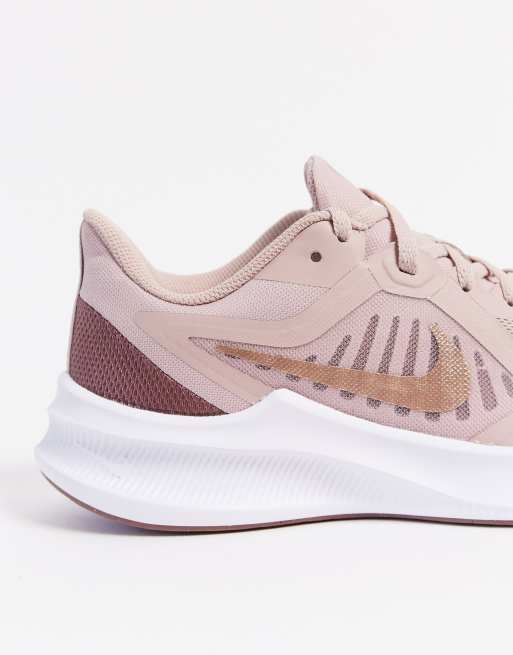 Nike Running Downshifter 10 trainer in rose gold