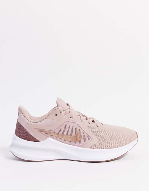 Nike Running Downshifter 10 trainer in rose gold