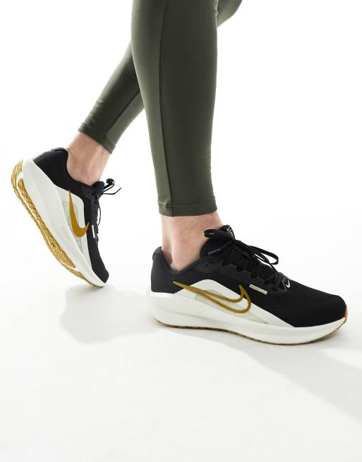 Nike Running Downshifter 13 sneakers in black and gold