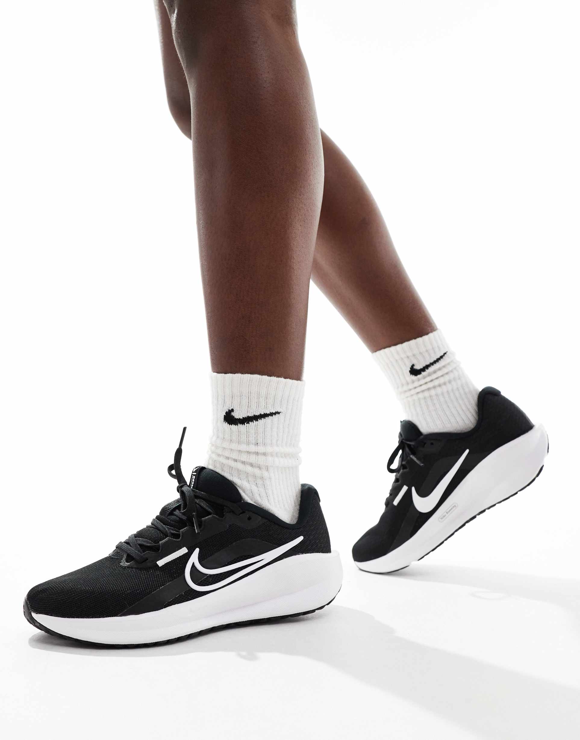 nike running downshifter 14 sneakers in black and white
