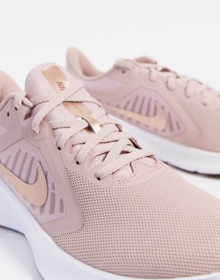 nike running downshifter trainers in pink