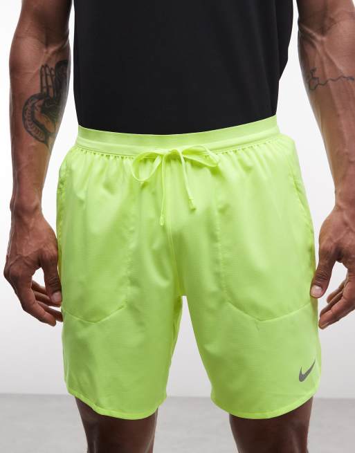 Nike Running Dri-Fit 7-inch shorts in lime green , 4 of 5