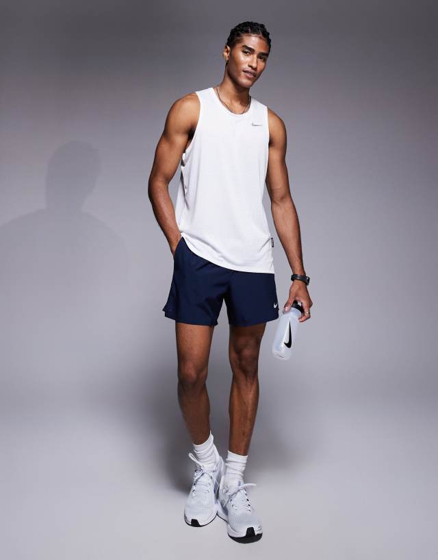Nike Running Dri-FIT Breathe Miler tank top in white | ASOS