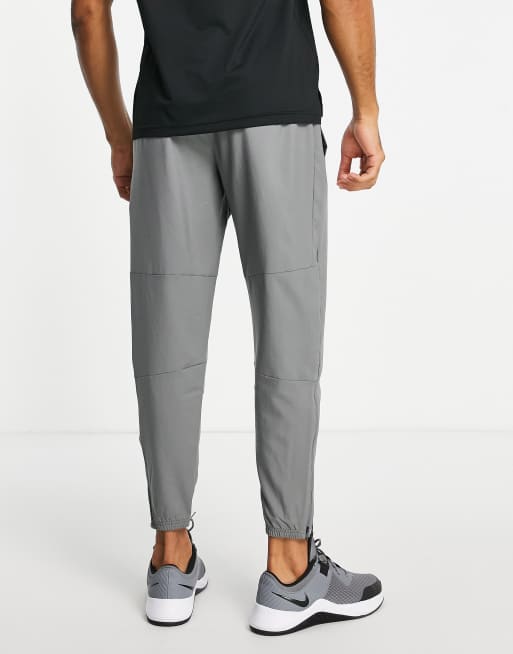 Nike Running Dri-FIT Challenger woven pants in gray