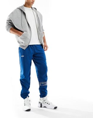 Nike Running Dri-Fit Flash Challenger reflective woven joggers in blue