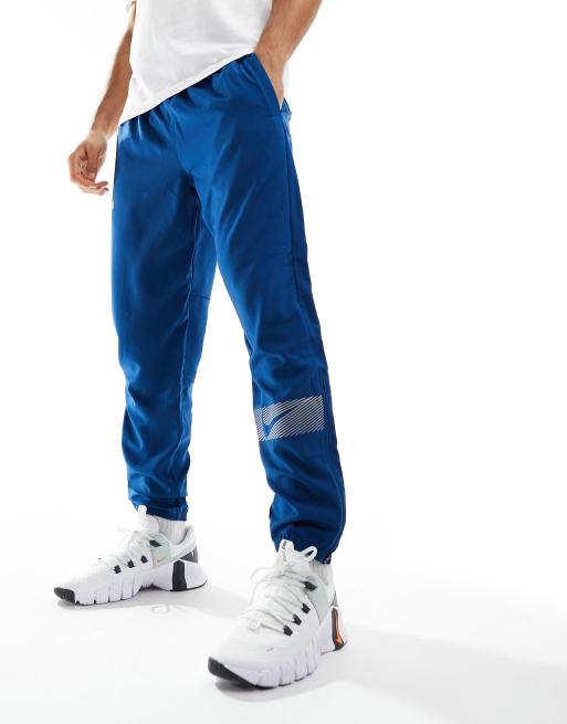 Nike Running Dri Fit Flash Challenger reflective woven joggers in