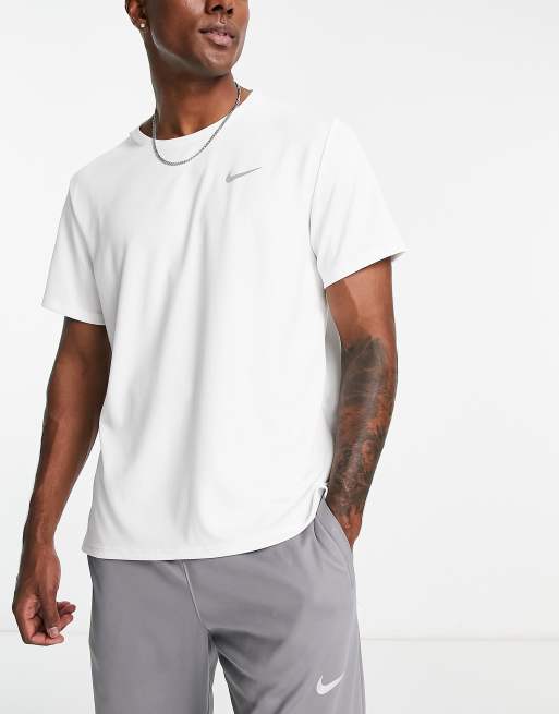 Nike Running Dri-FIT Miller T-shirt in white | ASOS