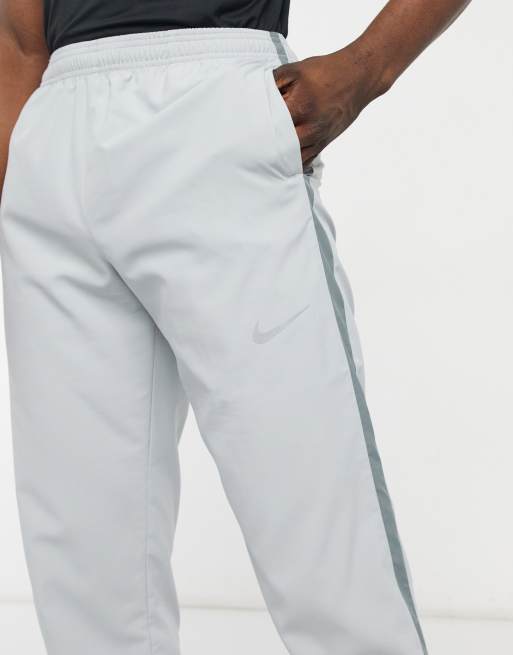 Nike Running Dri-FIT Run Stripe sweatpants in gray