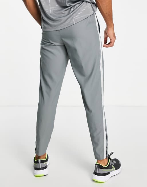 Nike Running Dri-FIT Stripe woven pants in gray