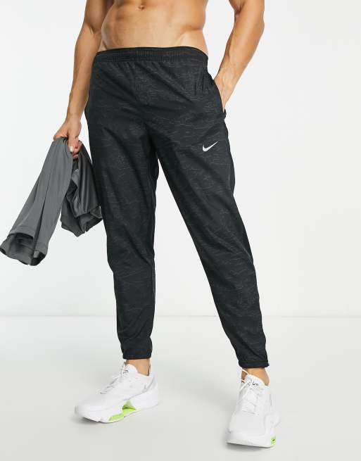 Nike Running Dri FIT sweatpants in black