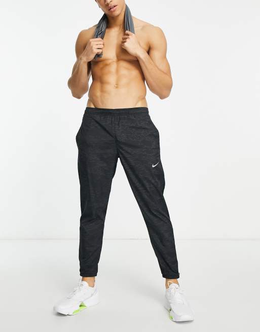 Nike Running Dri FIT sweatpants in black