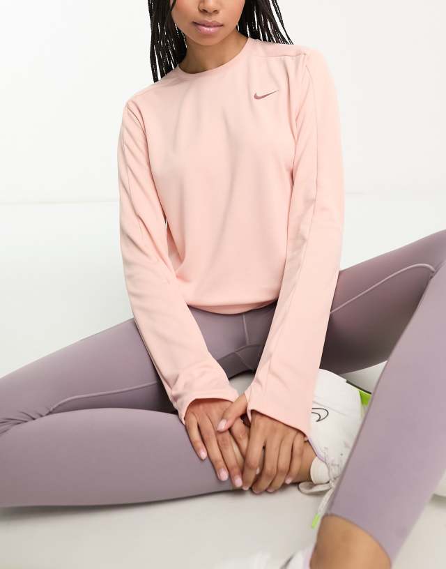 Nike Running Dri-FIT Swoosh midlayer top in pink