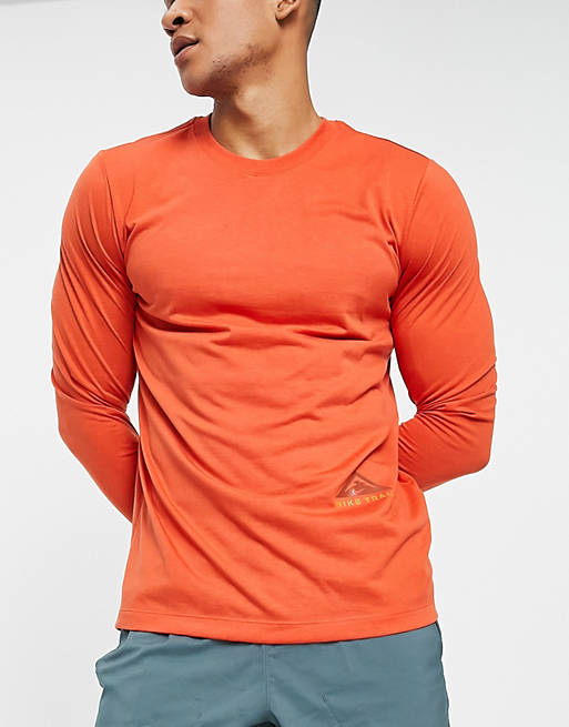 Slik Prædiken median Nike Running Dri-FIT Trail long sleeve t-shirt in orange | ASOS
