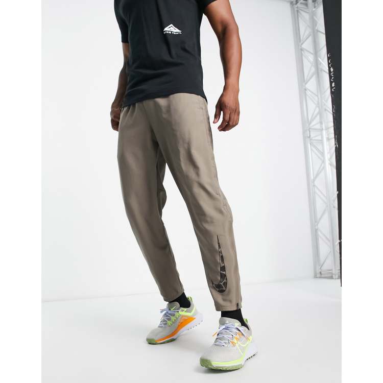 Nike Running DYE Challenger Dri-FIT joggers in stone | ASOS