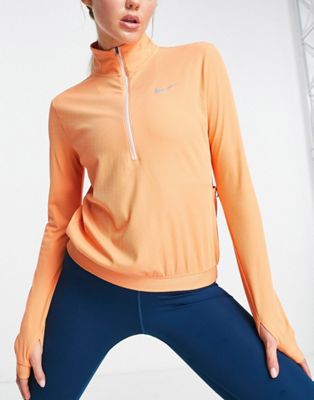 Nike Running Element Seasonal novelty Dri-FIT half zip top in coral - ASOS Price Checker