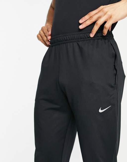 Nike Essential woven sweatpants in black, ASOS