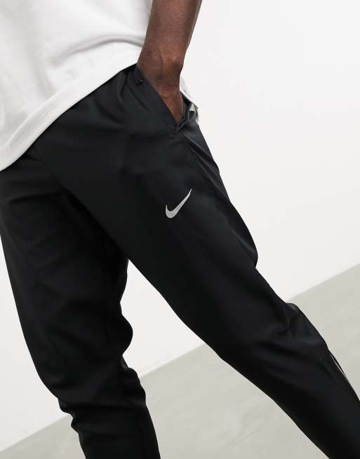 Buy Nike Sportswear Essential Woven Pants Black in UAE