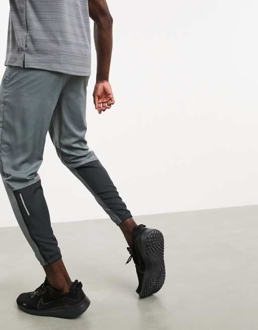 Nike Running essential woven pants in gray ASOS