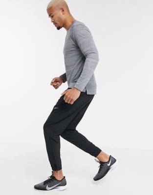 nike running essential woven sweatpants in black