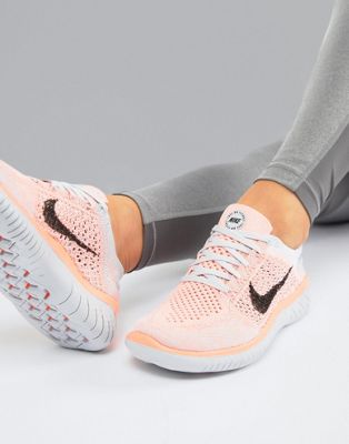 nike running free run flyknit trainers in grey and pink