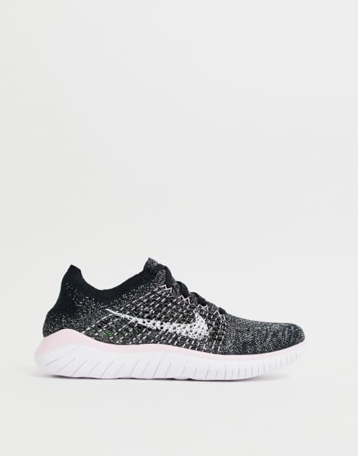 Running free run flyknit trainers in grey and clearance pink