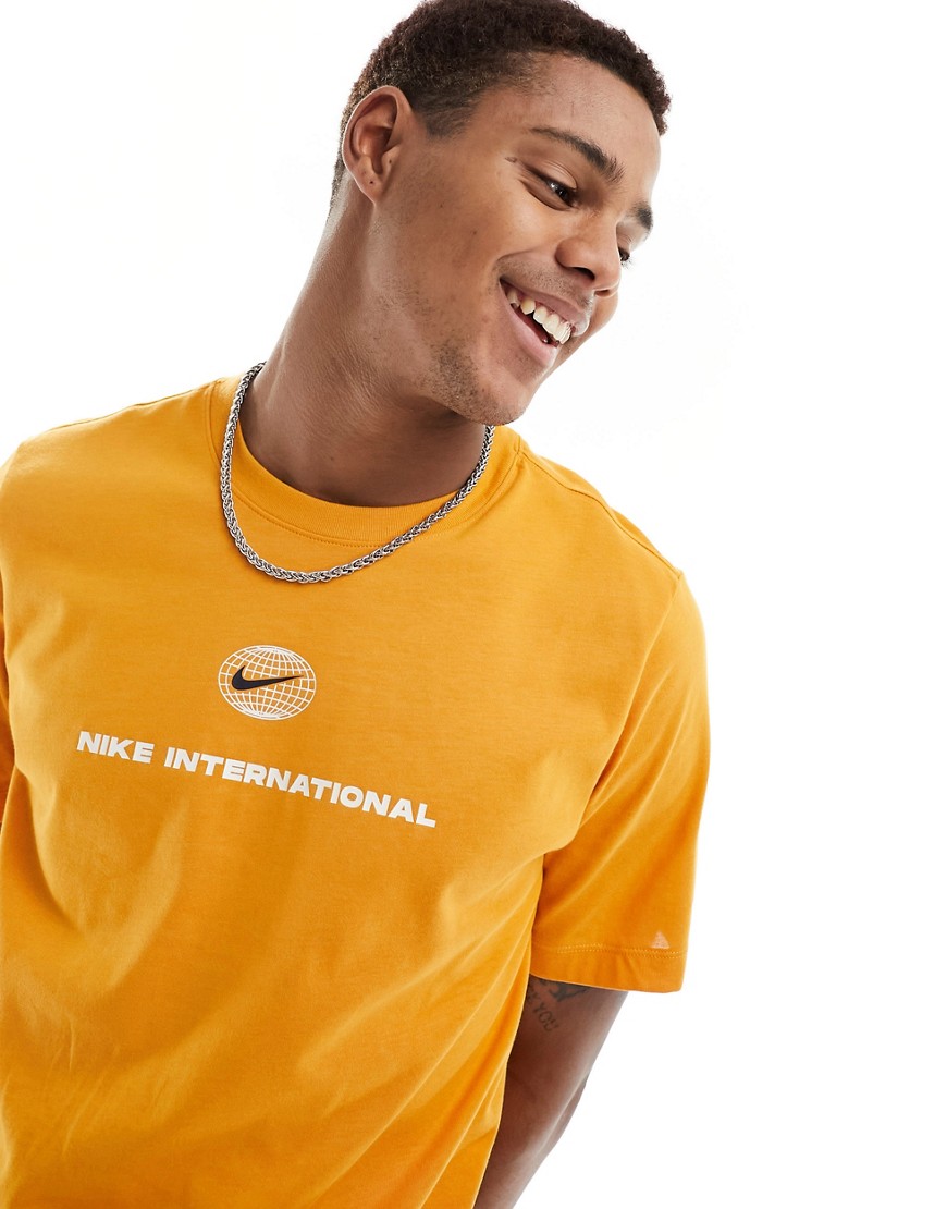 Nike Running Heritage Dri-FIT t-shirt in orange-Navy