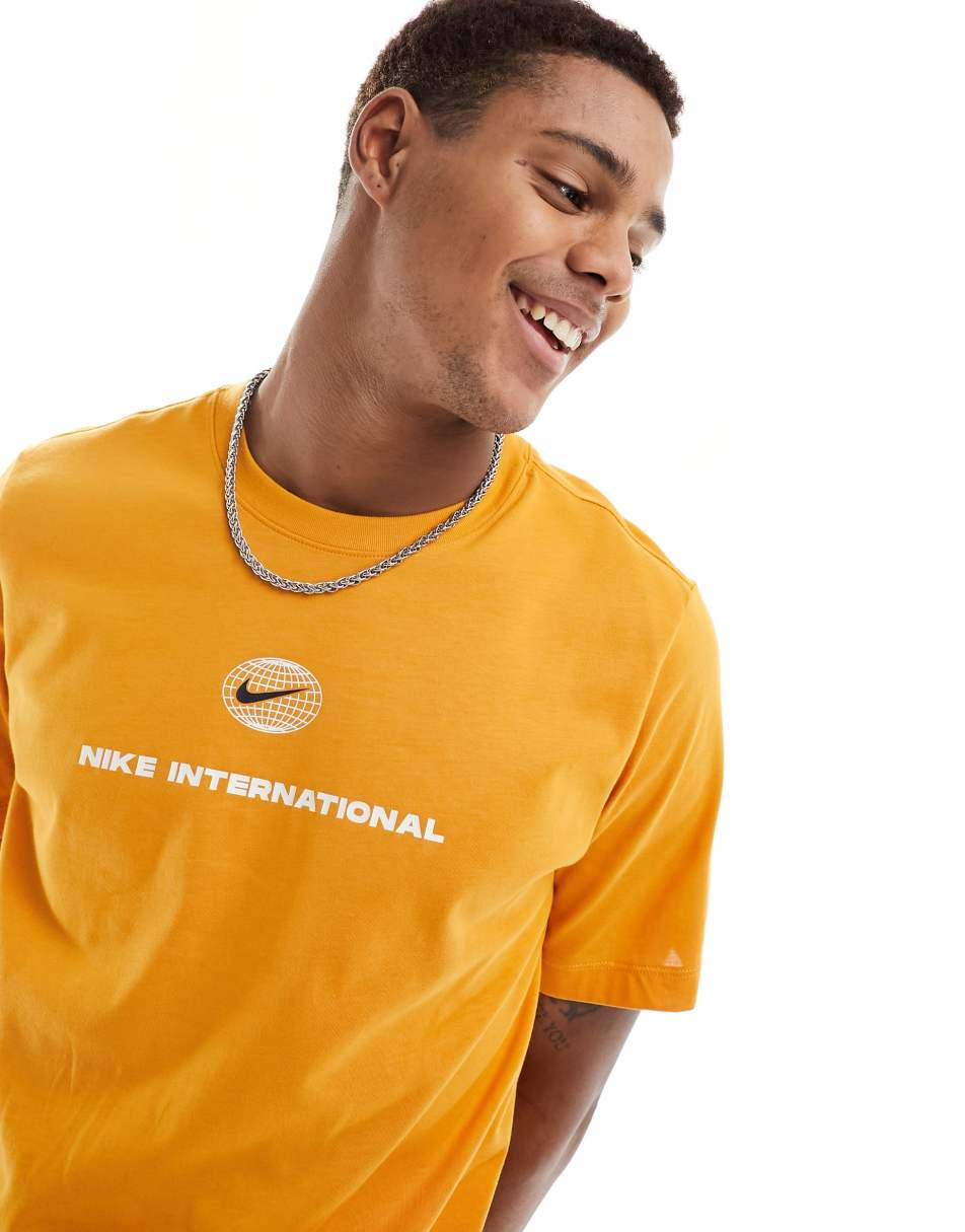 Nike Running Heritage Dri-FIT t-shirt in orange