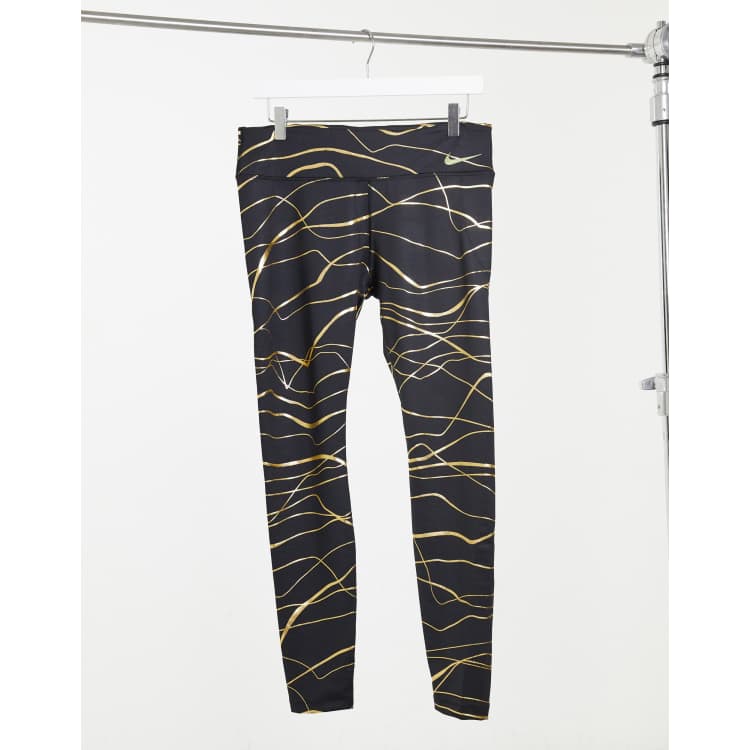 Nike Running Icon Clash Fast Tight leggings in black and gold