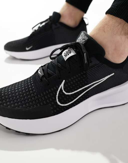 Nike Running Interact Run sneakers in black and white