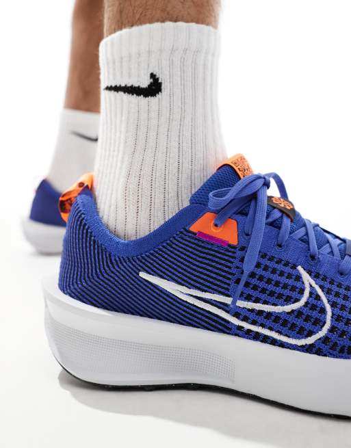 Nike Running Interact Run sneakers in blue and white | ASOS