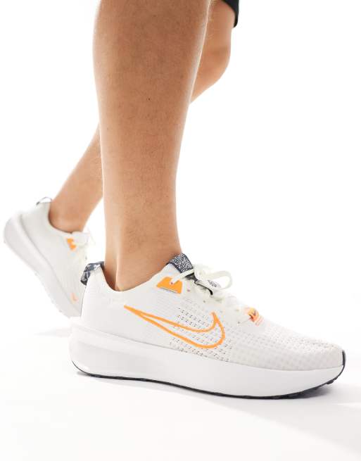 Nike Running Interact Run sneakers in off white and orange ASOS