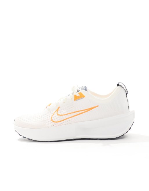 Nike Running Interact Run sneakers in off white and orange ASOS