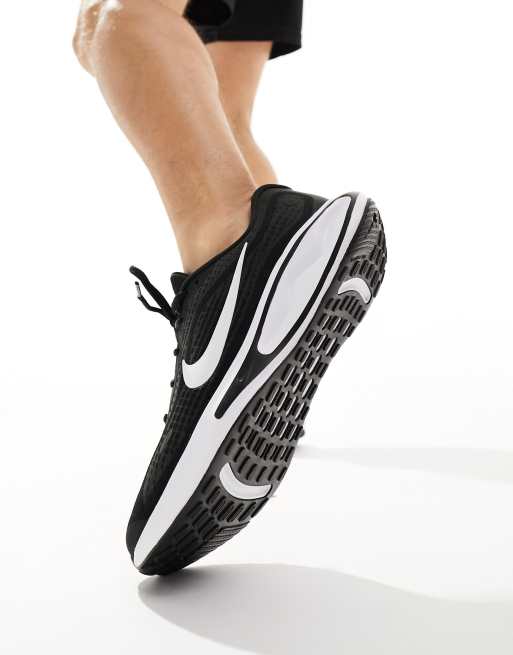 Nike Running Journey Run sneakers in black and white