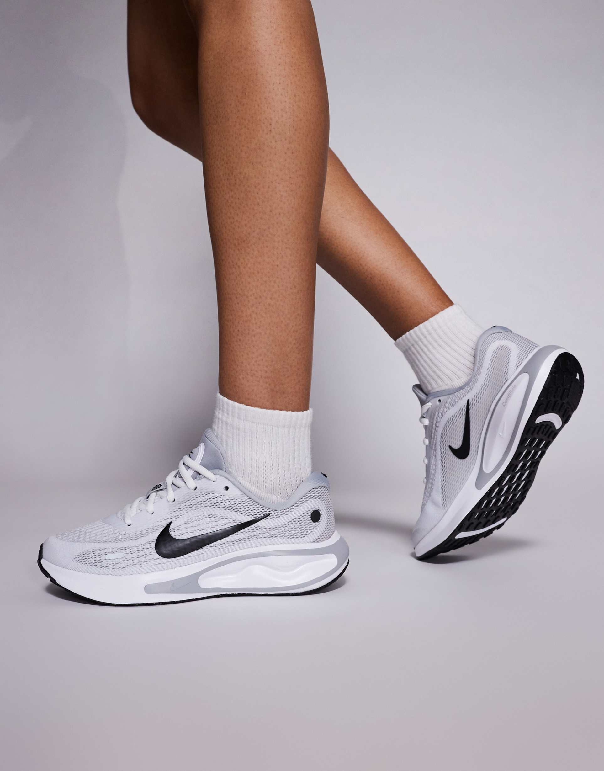 nike running journey run sneakers in white and black