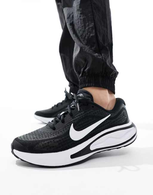 Nike Running Journey Run trainers in black and white