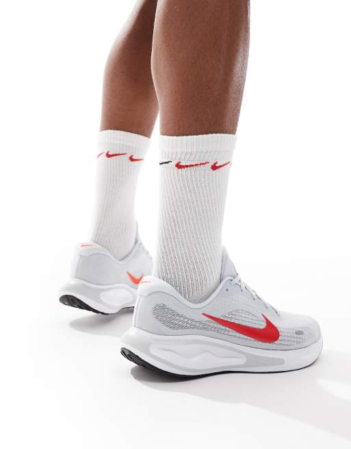 Nike Running Journey Run trainers in grey and red 