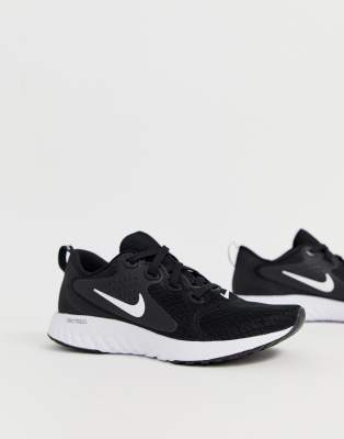 nike running legend react trainers in black and white