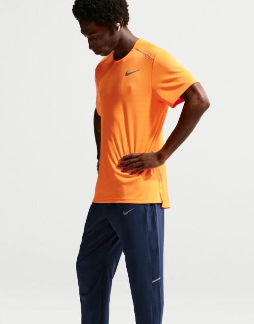 Nike Running Miler Dri-FIT pantalones de tejido para hombre en azul, 4 de 4