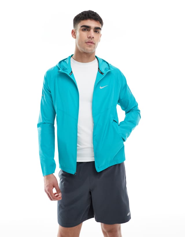Nike Running Miler jacket in light blue | ASOS