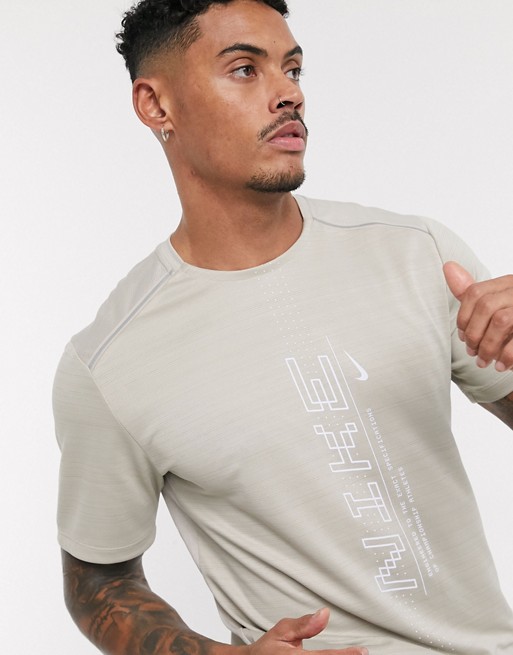 Nike Running Miler logo t-shirt in beige