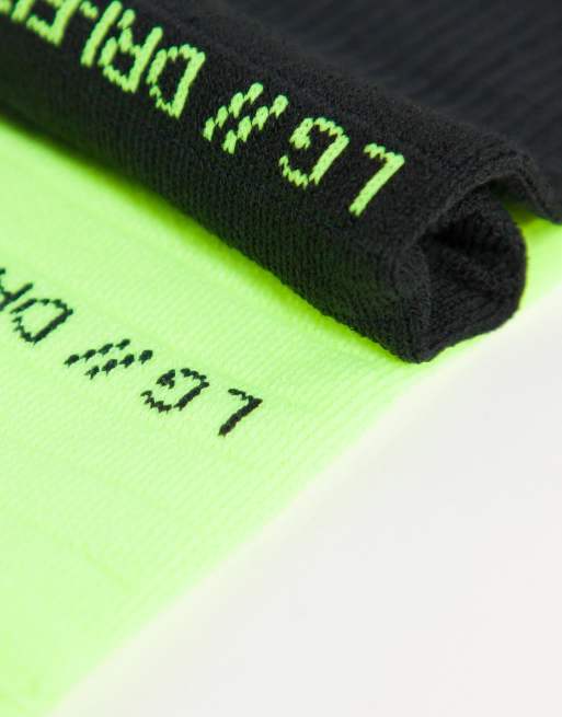 Nike Running Multiplier 2-pack crew socks in black and lime ASOS