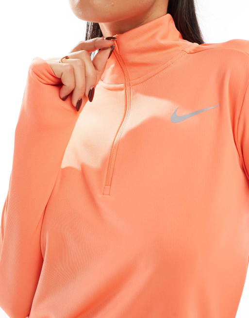 Orange nike half zip hotsell