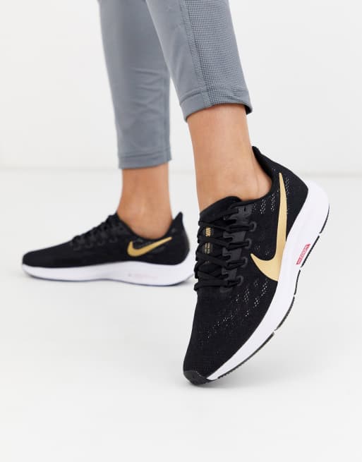 Nike black hot sale and gold runners