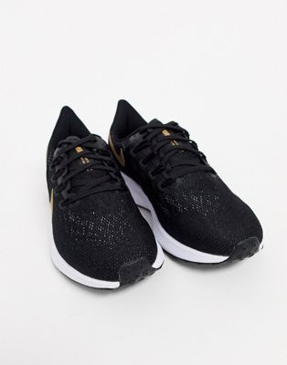 nike running pegasus 36 sneakers in black with gold swoosh