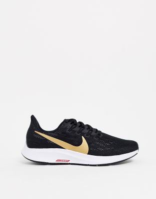 nike running pegasus 36 trainers in black with gold swoosh