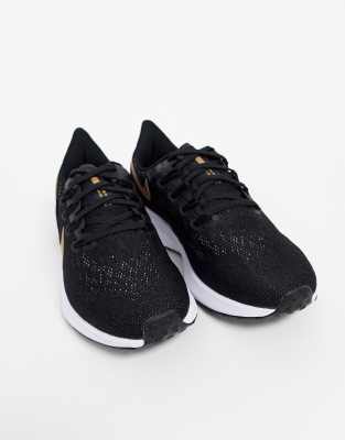nike running pegasus 36 trainers in black with gold swoosh