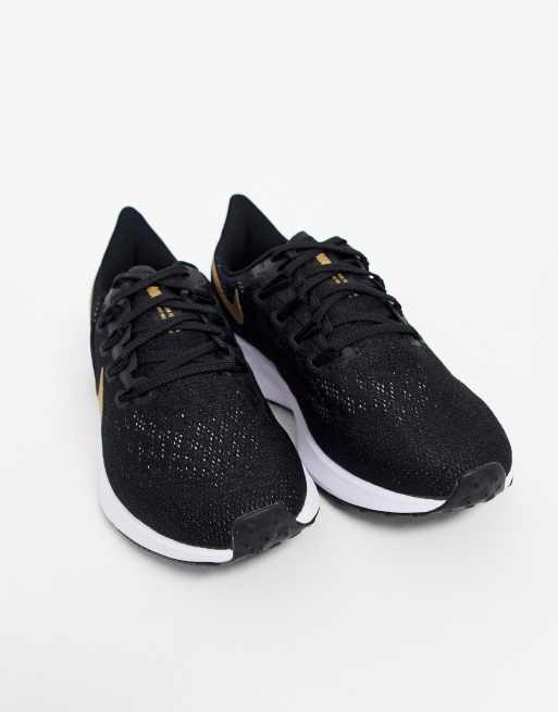 Running pegasus 36 trainers in black 2025 with gold swoosh