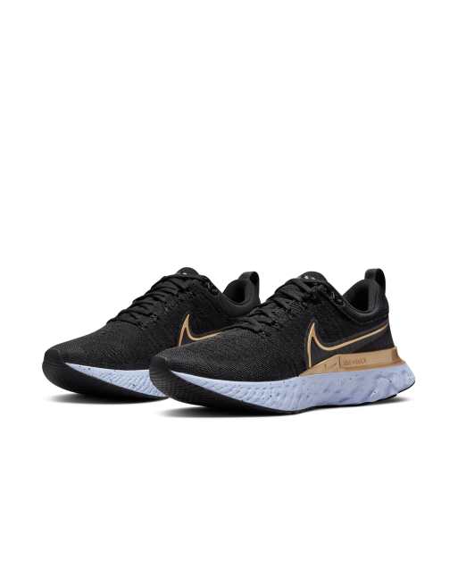 Nike react flyknit black gold best sale