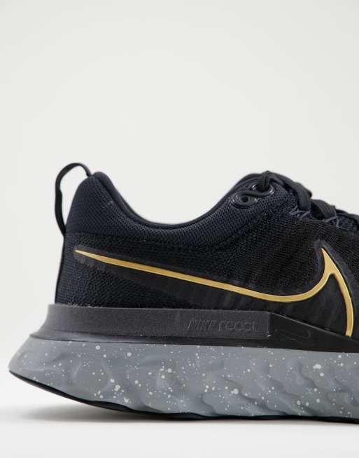 Nike Running React Infinity Run Flyknit trainers in black and gold