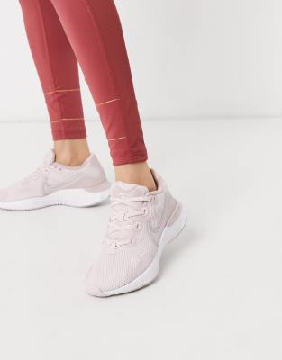 Nike Running Renew Run sneakers in rose 